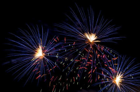 Bright festive fireworks. Light rays on a dark sky background. Abstract rays of light.の写真素材