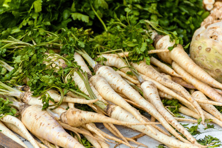 A closeup shot of parsley roots for sale at a marketの写真素材