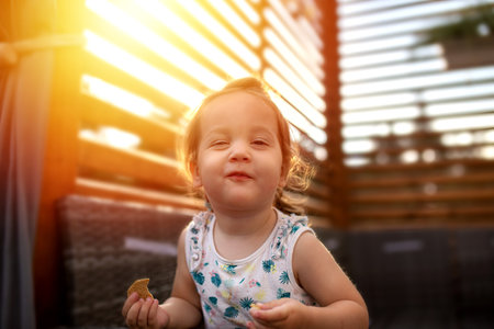 A closeup shot of a Caucasian toddler girl from Poland posing for a photoの写真素材
