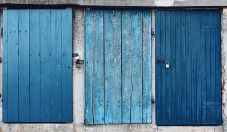 Old lockers with blue and white wooden doorsの写真素材