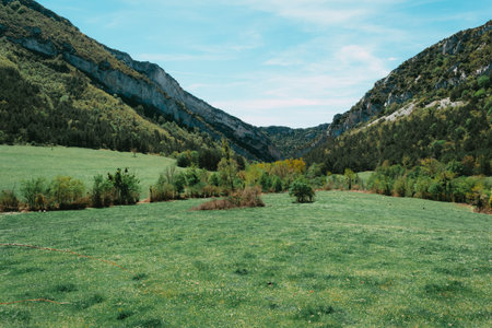 A landscape of the Valderejo Natural Park under a blue cloudy sky and sunlight in Spainの写真素材