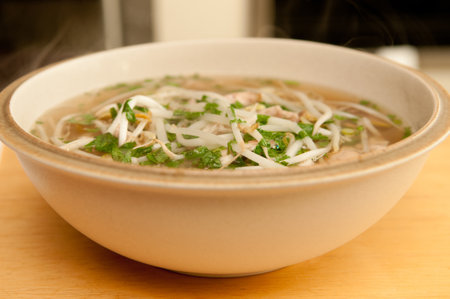 A closeup shot of an Asian soup with noodlesの写真素材