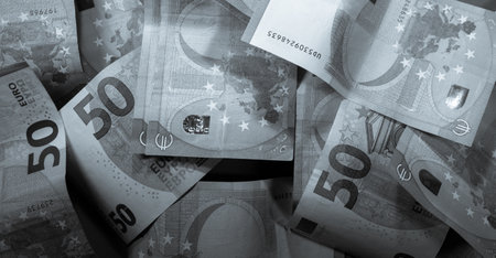 A grayscale shot of 50 euro banknotes