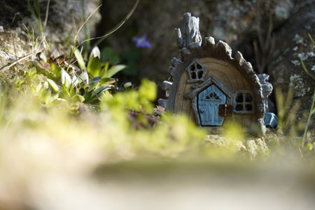 A fairy wooden birdhouse with a realistic door and windowsの写真素材
