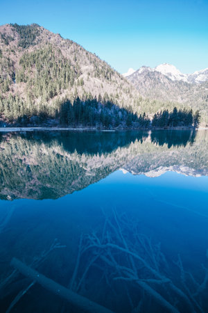 A mesmerizing view of a beautiful mountainous landscape in a lake reflectionsの写真素材