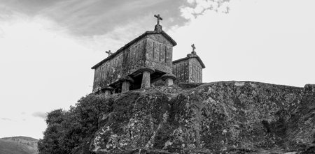 A grayscale shot of traditional old stone granaries in Soajo, Portugalの写真素材