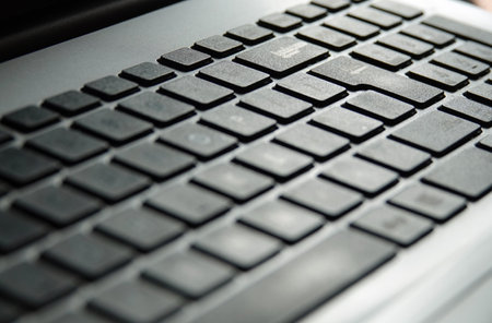 A selective focus shot of a keyboard on a laptopの写真素材