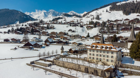A breathtaking aerial view of the snow-capped village of Rougemont, Switzerland