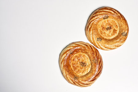 A top view of delicious homemade Danish pastry on a white surface with copy spaceの写真素材