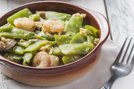 The scrambled eggs with shrimps, green beans and mushroomsの写真素材