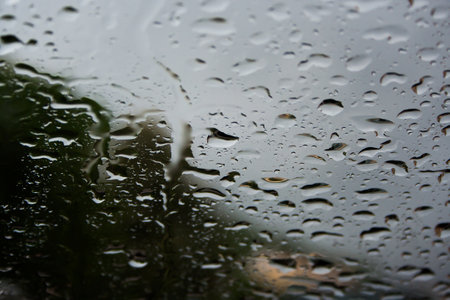 A closeup of water drops on window glassの写真素材