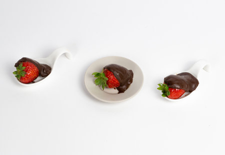 strawberries with chocolate on white backgroundの写真素材