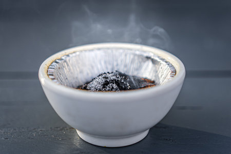 A jar of smoking coffee as a repellent for wasps and other insectsの写真素材