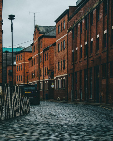 A vertical shot of a route surrounded by buildingsの写真素材