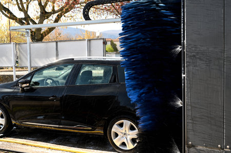 Blue brushes cleaning the carの写真素材