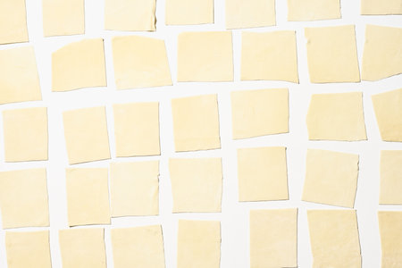 A top view of delicious homemade manti dumplings dough before being cookedの写真素材