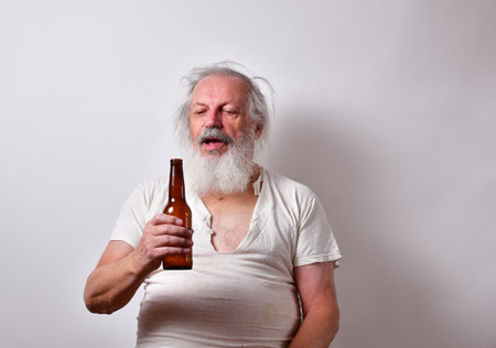 An alcoholic American male holding a beer bottle on white background