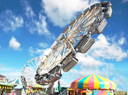 Midway ride at a state fair on a beautiful summer dayのeditorial素材