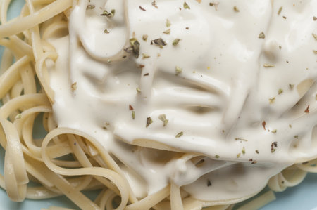 A closeup shot of a dish made with spaghetti with cheese saucの写真素材