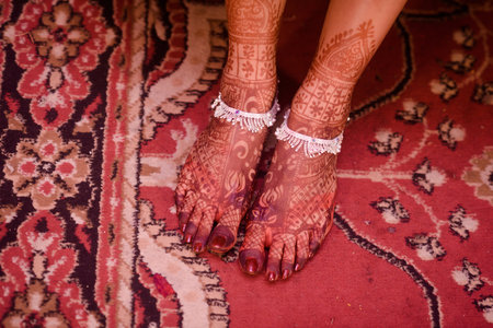 Mehendi art or Heena Tattoo on the legs of beautiful girl, Indiaの写真素材