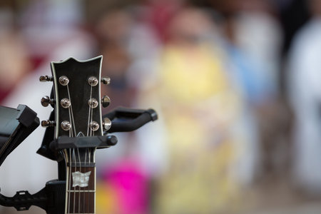 A closeup shot of a part of a guitar on a blurred backgroundの写真素材
