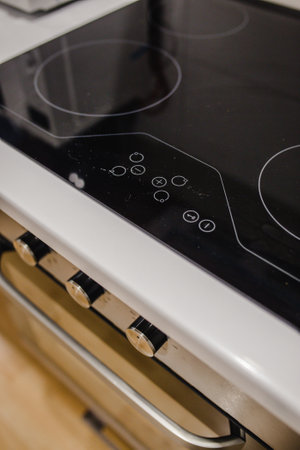 A vertical shot of an electrical stove in the kitchen