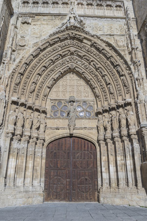 A vertical shot of the Cathedral of San Antolin under the sunlight in Palencia, Spainの写真素材
