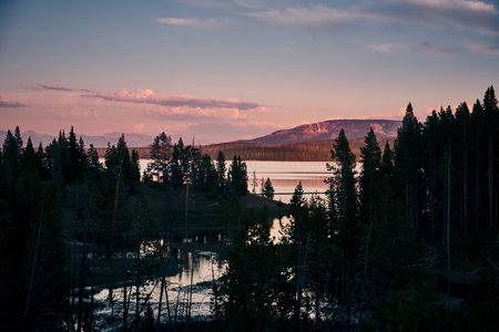 A scenic view of the Yellowstone Lake in Yellowstone National Park during sunset, Wyoming USA