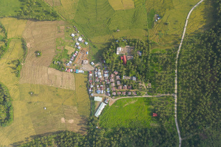 Aerial Drone Shot View of Houses and Buildings on a Mountain Village in a Tropical Island in the Philippines. During Hot Summer Holiday Vacation withの写真素材