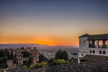 View of Alhambra Palace at sunset (Granada, Spain). HDR style with oversaturated color