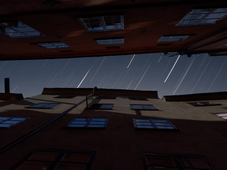 A low angle shot of two tall buildings on the night sky background, Stockholm, Gamla Stanの写真素材