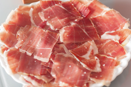 A closeup shot of slices of Spanish serrano hamの写真素材