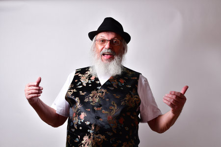 A happy American male with a fancy silk vest posed on white background