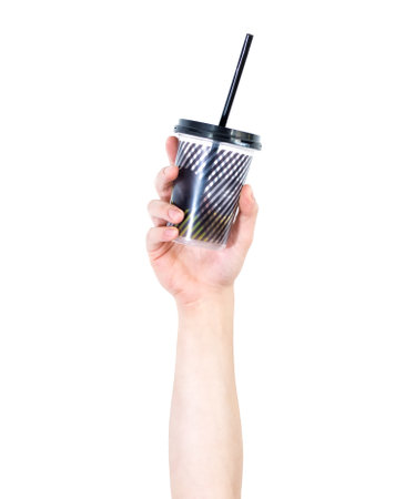 A person's raised hand holding a juice cup isolated on a white backgroundの写真素材
