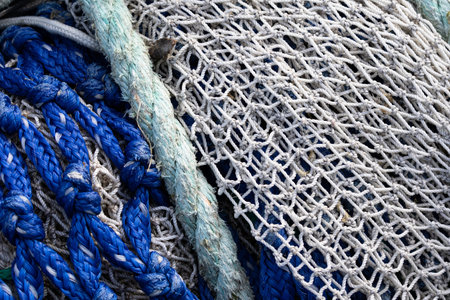 Two fishing nets with green rope