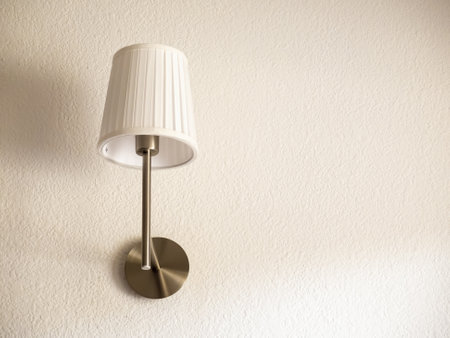 A sconce on a white wallの写真素材