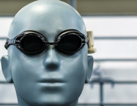 A closeup shot of a head mannequin wearing swimming gogglesの写真素材