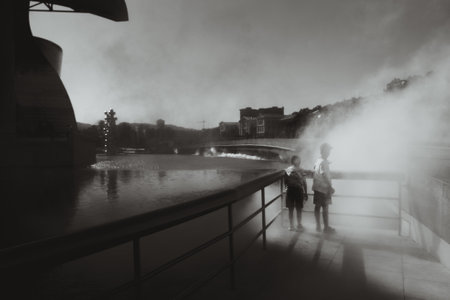 Kids in the fog in black and white.の写真素材