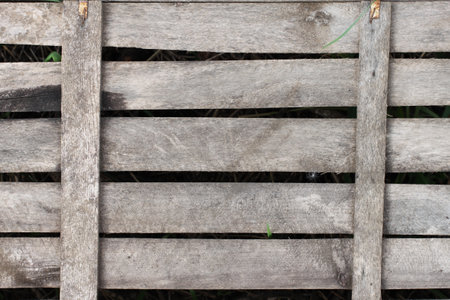 An old weathered wooden plank wall