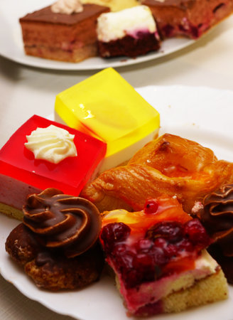 Variation of cakes served on platesの写真素材