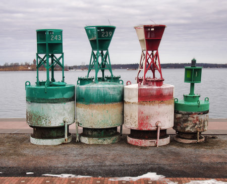 Navigational buoys docked on the shore of The Saint Lawrence Riverの写真素材