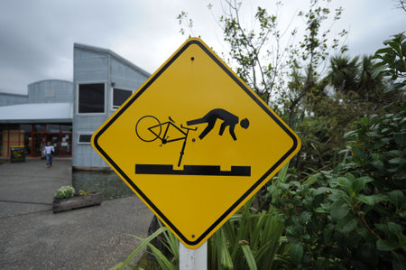 A selective focus shot of a fall from a bicycle road sign