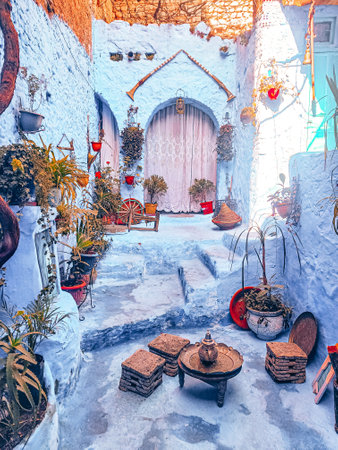 A traditional residential buildings with seats for Ramadan tea time in Chefchaouen, Moroccoの写真素材