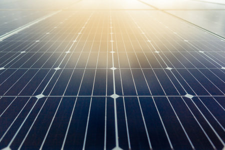 A low angle shot of modern solar panels under the sunlight - environmental concept