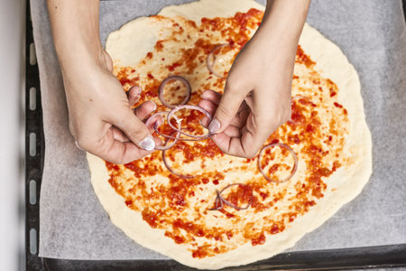The process of making a delicious homemade pizzaの写真素材