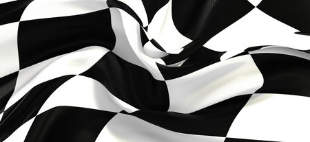 A waving white and black flag checkered for a raceの写真素材