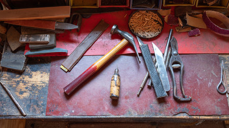 old tools on the shoemaker's workbench