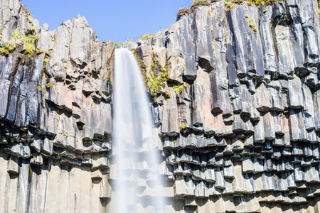 A closeup shot of the Svartifoss Skftafell waterfall in Iceland