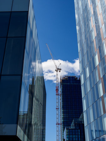 Modern office buildings new construction and craneの写真素材