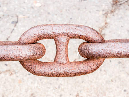 A closeup shot of a rustic chain on a blurred backgroundの写真素材